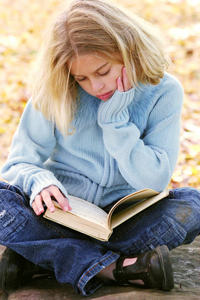 istock little girl reading 91042486