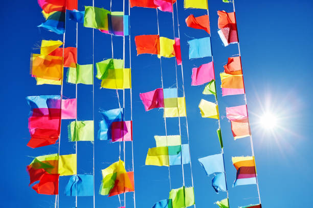 istock Colorful prayer flags against sun and blue sky. 910426752