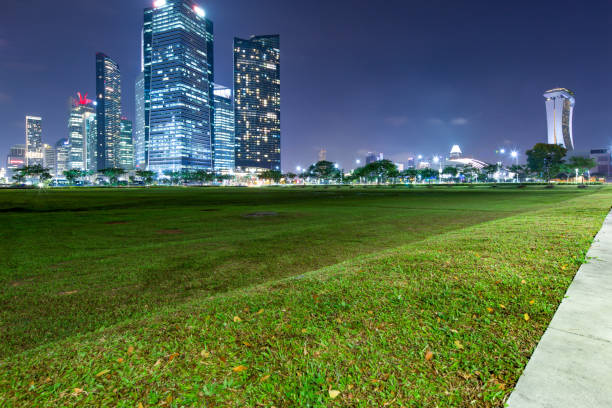 istock green grass land near modern buildings 910427016