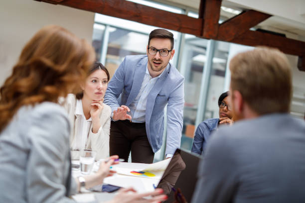 istock Business partners discussing documents and ideas at meeting 910430416