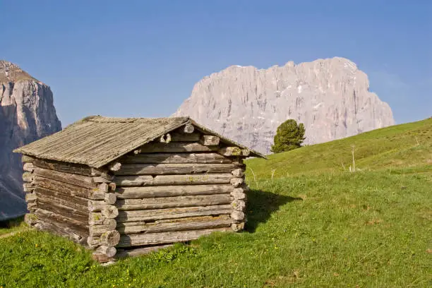 On the Gardena Pass - idyllic hay huts in block construction, the landscape of South Tyrol is indispensable