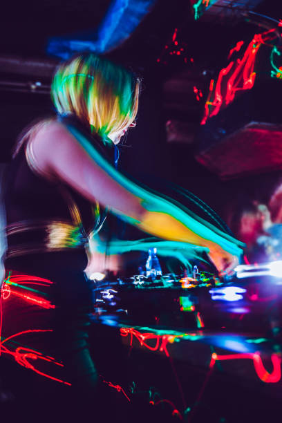 Young Woman DJ In Action on Turntables.