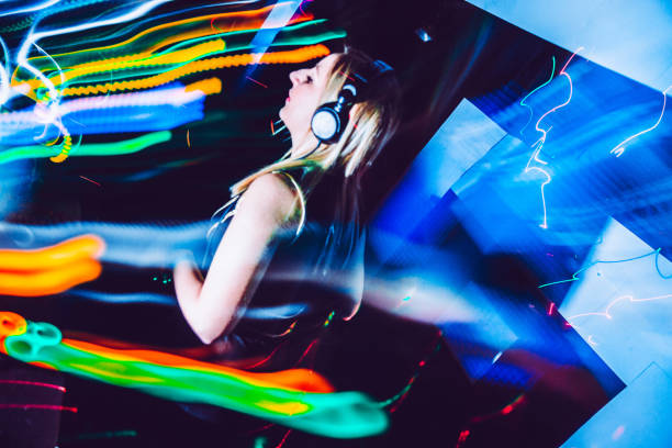 istock Young Woman DJ Performing on Stage 910434480