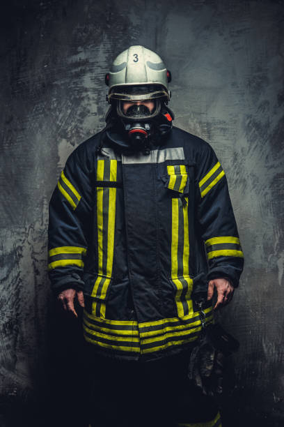 istock Rescue man in firefighter uniform. 910435490