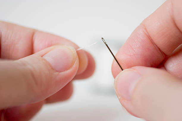 istock threading the eye of a needle 91043900