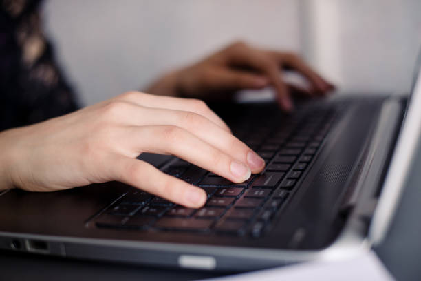 istock Hands write on the keyboard of a laptop 910439034