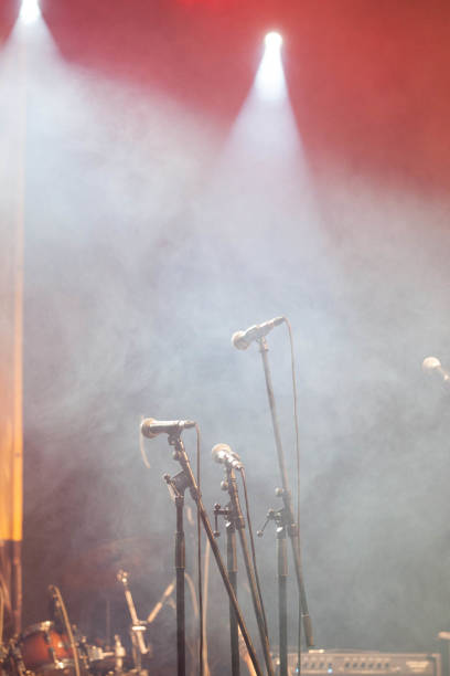 istock microphones standing on the stage - concert 910444300