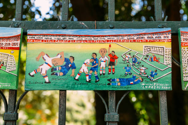 演出者在他的繪畫旁邊 depecting 在足球的標誌性時刻 - flamengo 個照片及圖片檔
