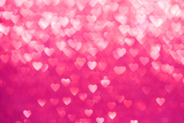 istock Red Sparkling Defocused Lights of Hearts Background 910444996