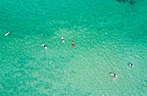Surfers from above in Lanzarote Spain