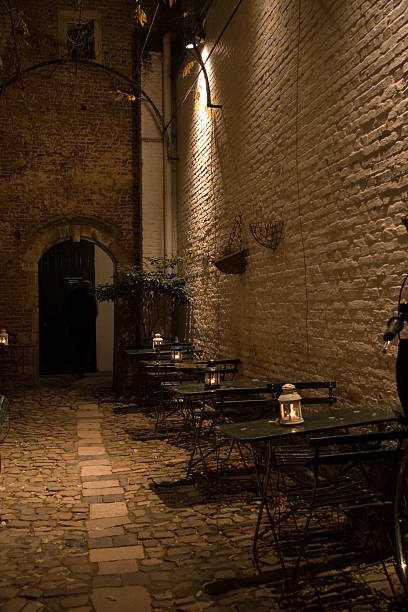 istock romantic alleyway with table and candles 91044982