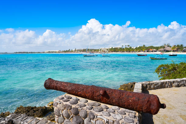 istock Akumal beach rusted canon in Riviera Maya 910453598