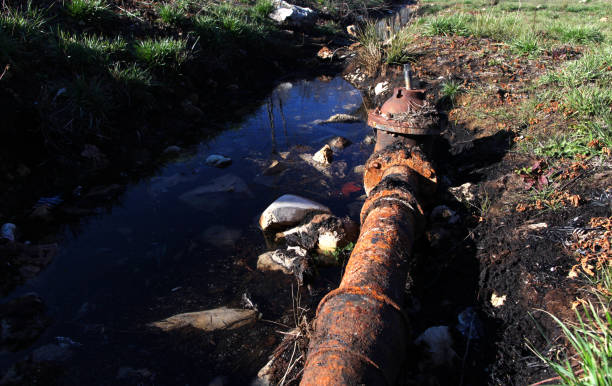 istock Dirty water discharged into river. Pollution water 910453692