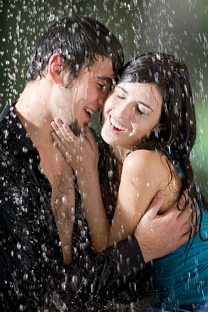 istock Young couple hugging and under a rain, in passion 91045724