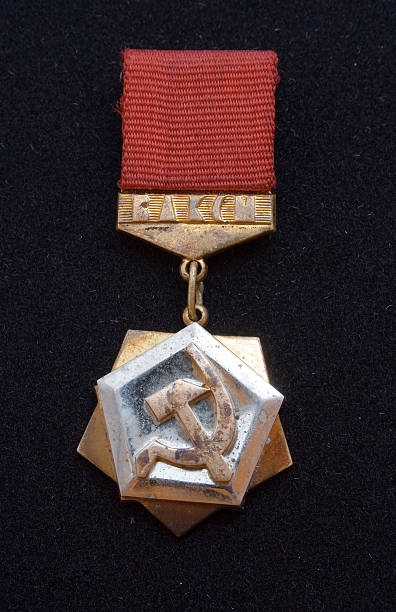 istock corroded Lenin's komsomol insignia on black 91046516