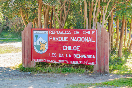 CHILOE, CHILE, APRIL - 2017 - Chiloe national park signpost information with spanish text which say \