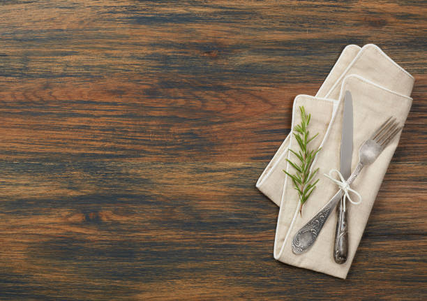 istock Towel and silverware on a wooden table 910468116