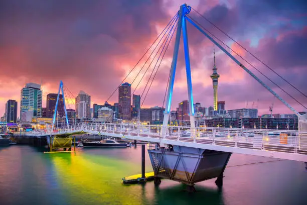 Cityscape image of Auckland skyline, New Zealand during sunrise.
