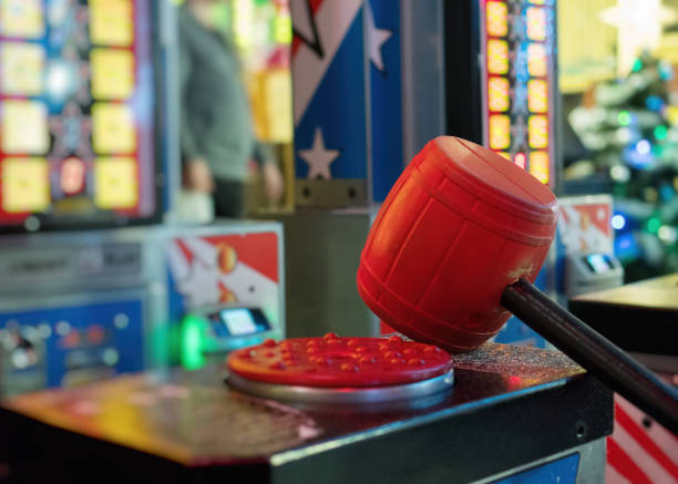 istock Test your strength hammer game in theme park. 910469166