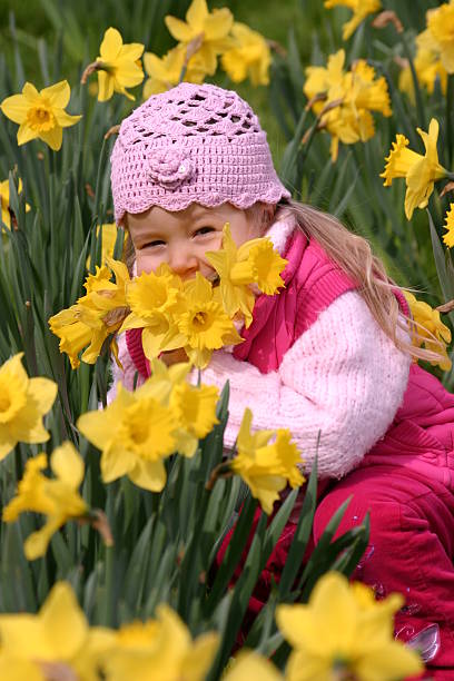 istock Child in yellow daffodils 91047223