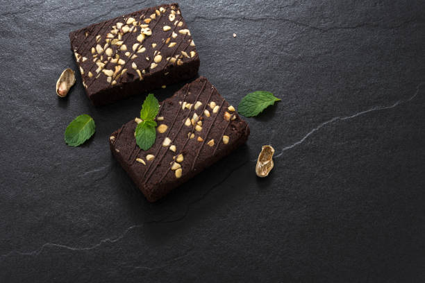 istock Brownies with peanut on wood 910473828