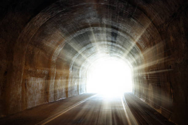 licht am ende des tunnels - horizontal orientation flash stock-fotos und bilder