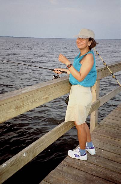 istock Trying Her Luck at the Pier. 91047517