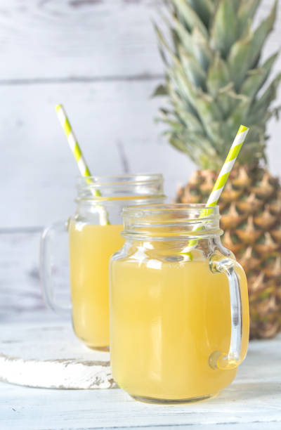 istock Two glasses of pineapple juice 910480584