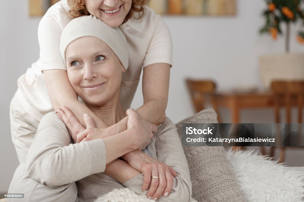 Family member supporting sick woman Family member supporting sick woman during chemotherapy Cancer - Illness Stock Photo