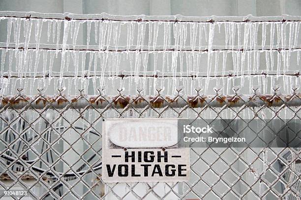 Ironyicy Danger High Voltage Stock Photo - Download Image Now - Barbed Wire, Cable, Chainlink Fence