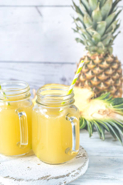 istock Two glasses of pineapple juice 910481254