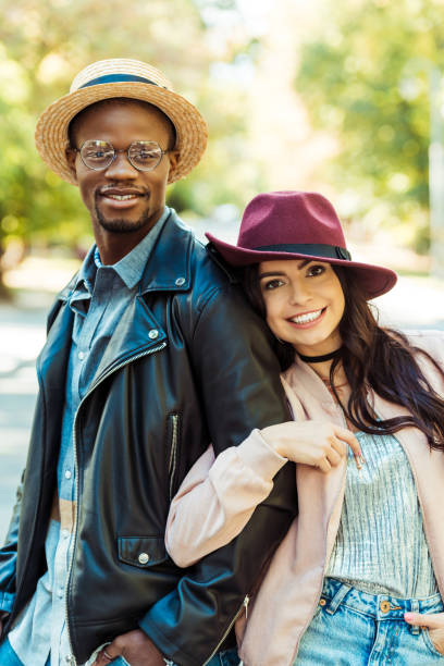istock Girlfriend hugging her boyfriend on street 910484262