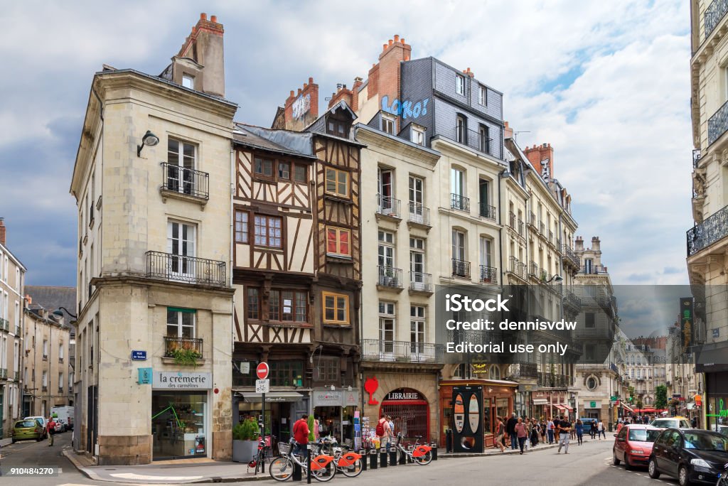 Cityscape of Nantes Beautiful cityscape view of the generic architecture of the houses with shops in Nantes, France, with people in the streets on July 29, 2014 Nantes Stock Photo