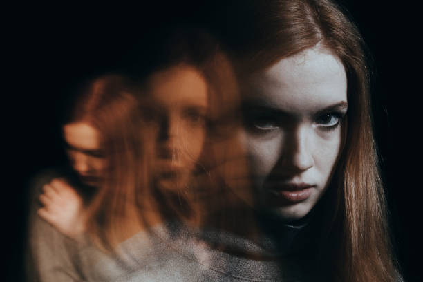 Blurred figures of red-haired girl Blurred figures of a red-haired girl. Concept of mental illness post traumatic stress disorder photos stock pictures, royalty-free photos & images