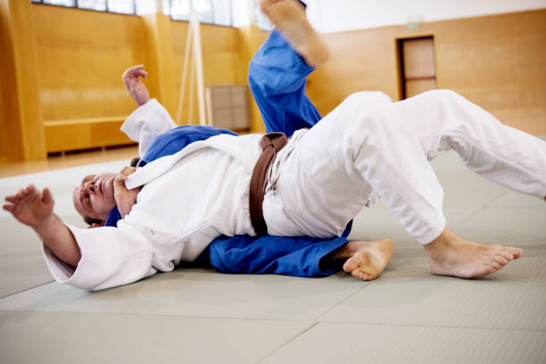 istock Two Adult Judoists Fighting on the Ground 910485036
