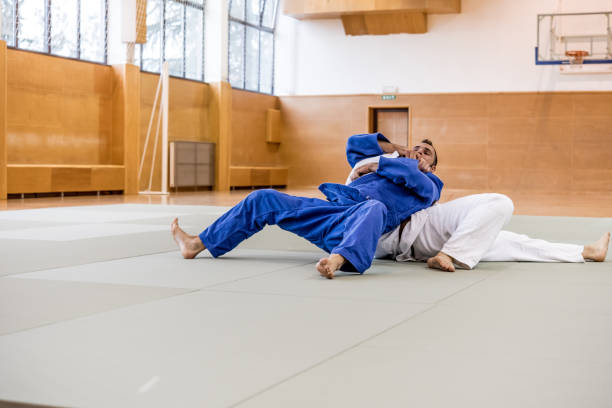 istock Judoist Holding his Adversary on the Ground 910485064