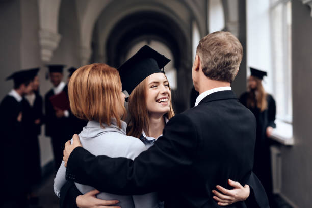 istock Parents congratulate the student, who finish their studies at the university. 910488408