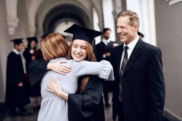 istock Parents congratulate the student, who finish their studies at the university. 910488464