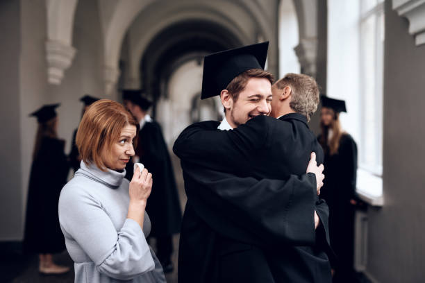 istock Parents congratulate the student, who finish their studies at the university. 910488476