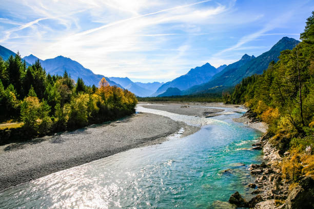 Lechriver at autumn, near Forchach, Lechtaler Alps, Tirol, Austria Lechriver with view of the Lechtaler Alps, Tirol, Austria riverbank stock pictures, royalty-free photos & images