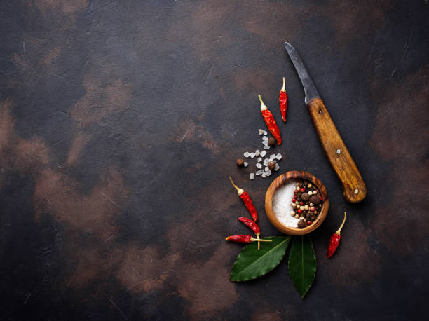 istock Cutting board with herbs and spices. Culinary background 910489034