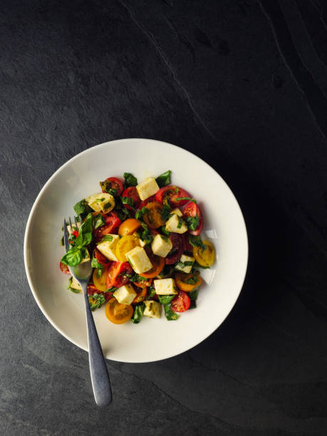 istock Healthy Tomato and basil salad with mozzarella cheese 910489208