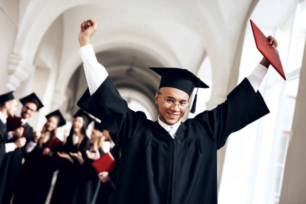 istock The guy in the mantle poses at the university. 910493730