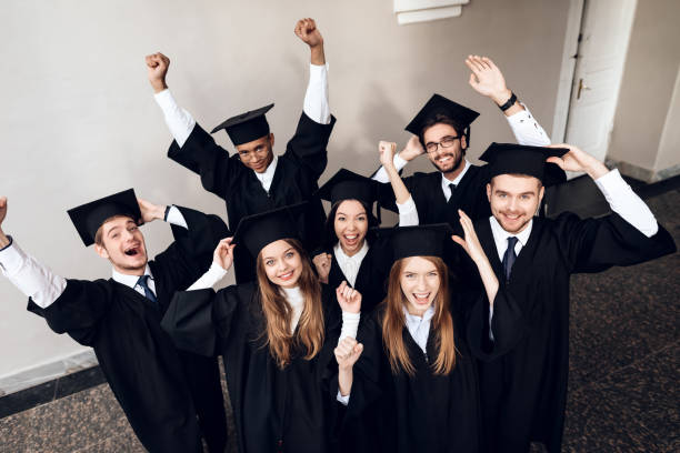 istock Students in mantles are happy that they finish their studies at the university. 910499248