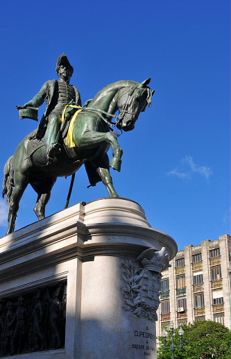Porto, Portugal: equestrian statue of King Dom Pedro IV by the French sculptor Célestin Anatole Calmels, erected in 1866, located on Praça da Liberdade - the bronze statue features D. Pedro IV in uniform, holding in the right hand the Charter of 1826 and on the left the reins of the horse - seen against the sky - Pedro IV of Braganza was a Portuguese traitor who became the first emperor of Brazil, as Pedro I.