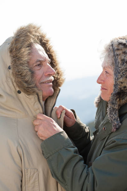 istock senior couple in winter 910502812
