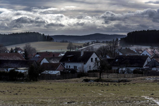 istock a small frozen village in the valley between meadows and fields 910505978