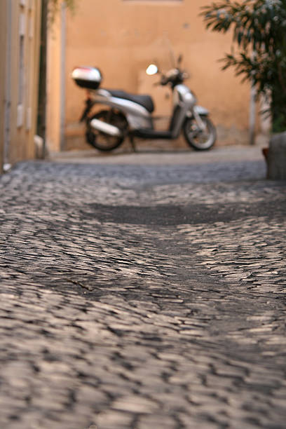 istock Roman scooter and cobblestone background 91050613