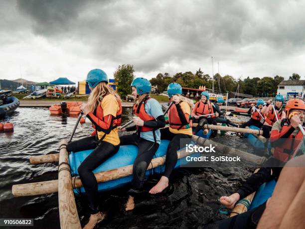 Paddling A Raft Stock Photo - Download Image Now - Team Building, Wooden Raft, Recreational Pursuit