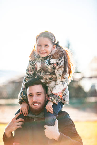 istock Millenium Family, Father Carrying his Daughter 910507308